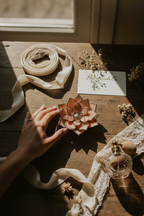 Dramatic wedding table scene with well-lit Dusty Rose ring dish
