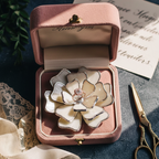 Flower-shaped stained glass ring dish in dusty rose velvet box
