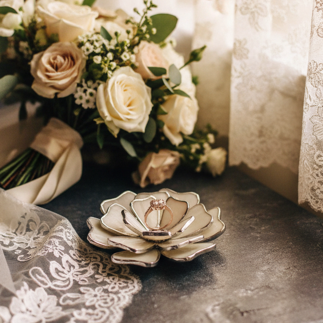 Warm cinematic pre-ceremony scene with lace curtains